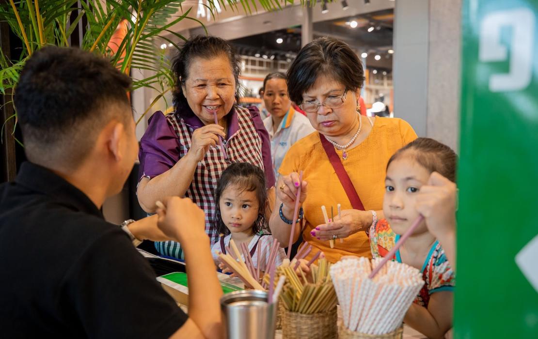 Shoppers comparing plastic straw alternatives.