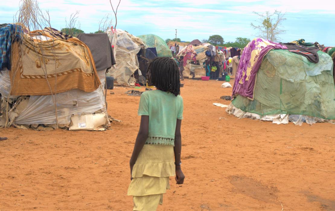 A gril walking in a settlement in Namibia