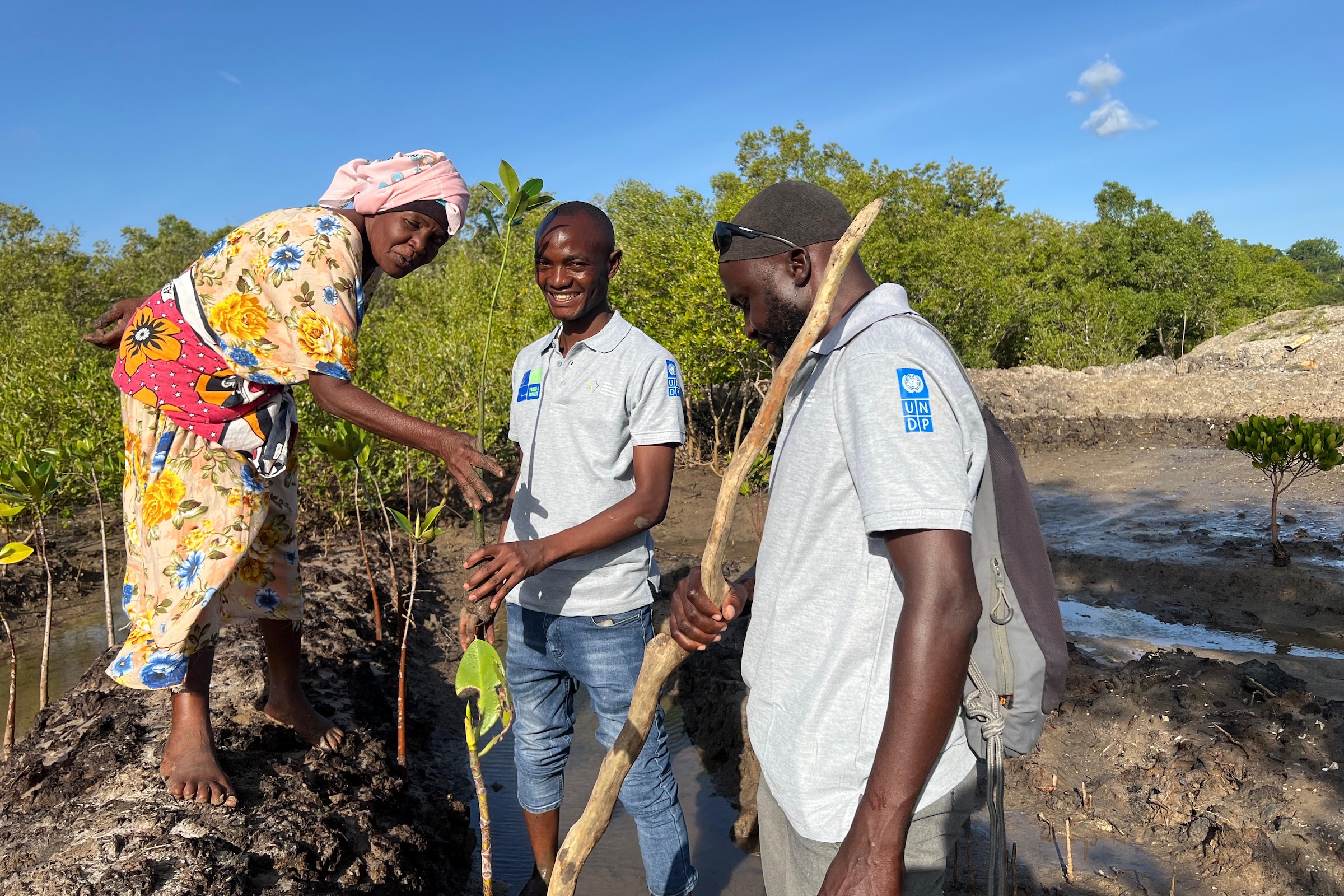 Neville and the local community planting mangroves