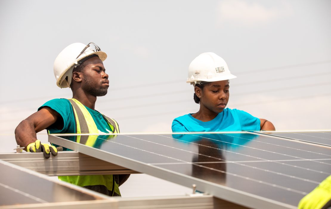 The framework helps policymakers make informed decisions for a just transition, allowing for green jobs creation. Photo: UNDP Zimbabwe Two workers in safety gear collaborate to install solar panels on a rooftop structure in Zimbabwe. Photo: UNDP Zimbabwe