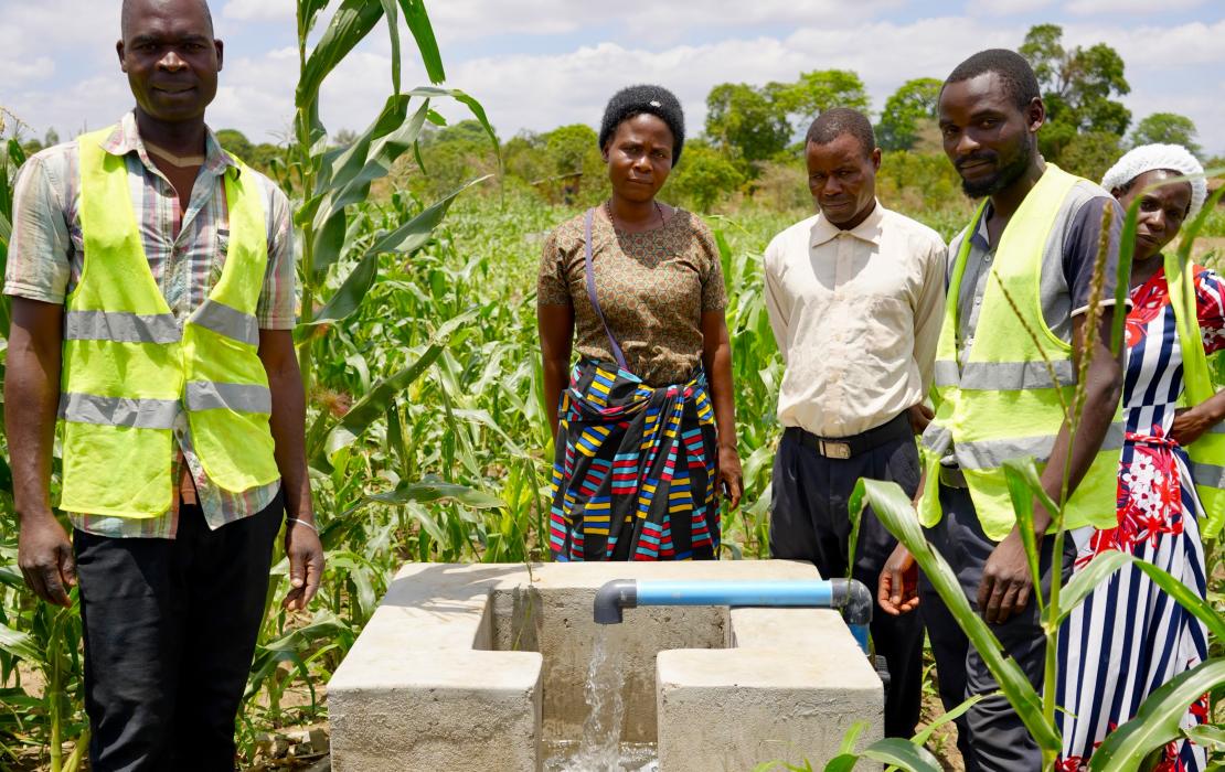 Farmers showing how they are using the new solar-powered irrigation installation in Zomba district.  