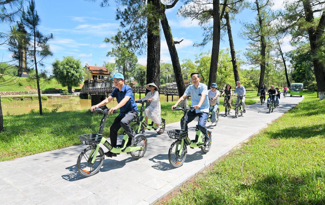 Group riding environmentally-friendly bikes in the park