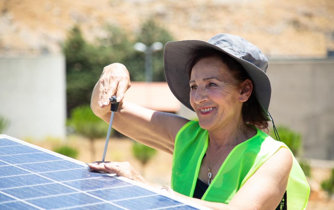 Woman installing solar panels in Lebanon