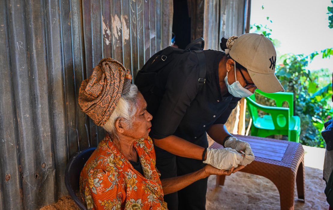 Timor-Leste finalized and endorsed its HNAP in 2022. The country has developed a national policy and strategy on Climate Resilient and Environmentally Sustainable Healthcare Facilities. Photo: WHO Timor-Leste A health worker in Timor-Leste conducts a check-up on an elderly woman outside her home—demonstrating how climate-resilient health services are reaching vulnerable populations amid rising climate-related health risks.