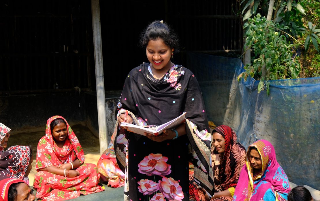 Twenty-six year old Shapna Munda leads a community meeting with women in coastal Bangladesh.