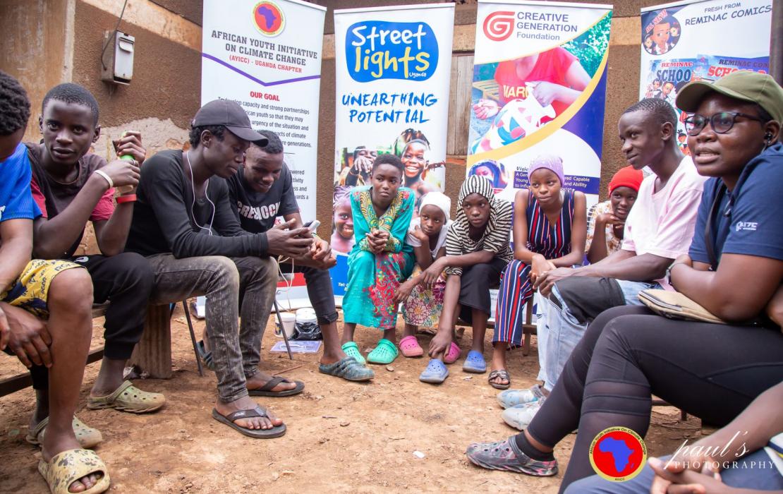 JulietGrace talking about climate with other youth in Uganda. Photo: Philip Mwebaza. JulietGrace talking about climate with other youth in Uganda.