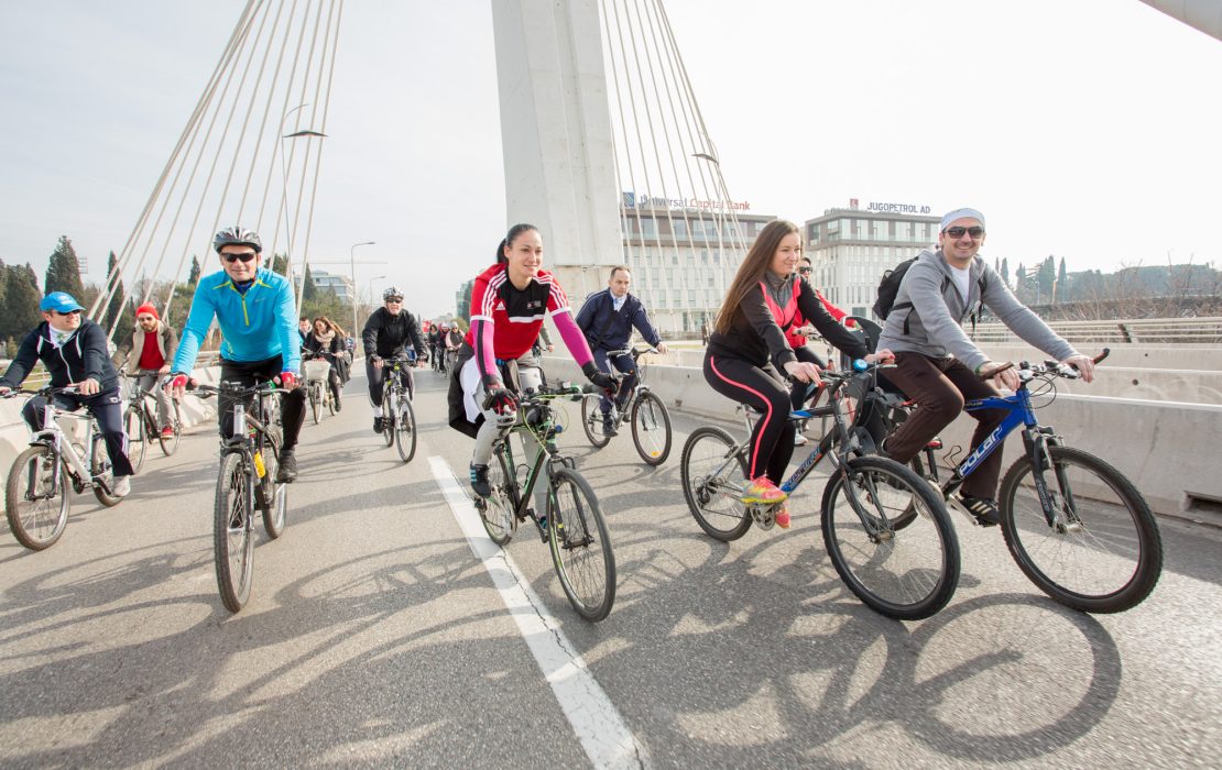 Cyclists riding across a city bridge in Montenegro. Photo: UNDP Montenegro Cyclists riding across a city bridge in Montenegro
