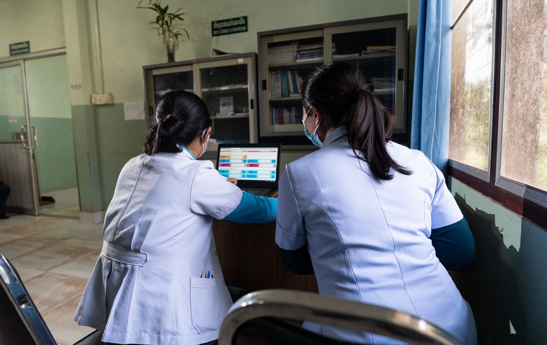 Lao PDR has developed a comprehensive nine-module climate and health training programme and integrated it into academic curricula to build long-term institutional capacity. Photo: WHO Lao PDR Two healthcare workers in Lao PDR review digital disease surveillance data from a climate-integrated early warning system—strengthening preparedness for climate-sensitive health threats like heatwaves and outbreaks.