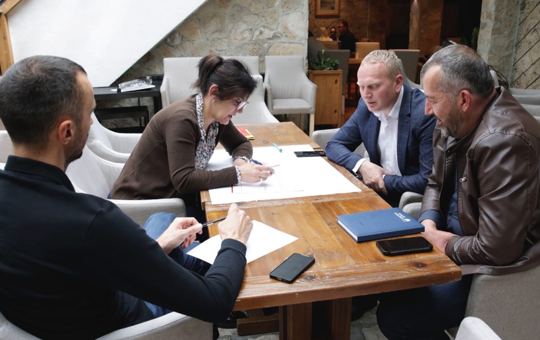 Municipal representatives and Ministry of Interior officials participate in a Post-Disaster Needs Assessment training in Montenegro. Photo: UNDP Montenegro Municipal representatives and Ministry of Interior officials participate in a Post-Disaster Needs Assessment training in Montenegro, seated around a table reviewing documents.