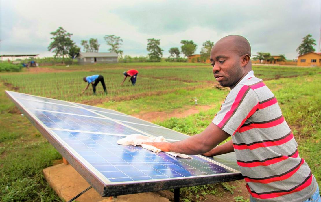 A man and a solar panel in Benin