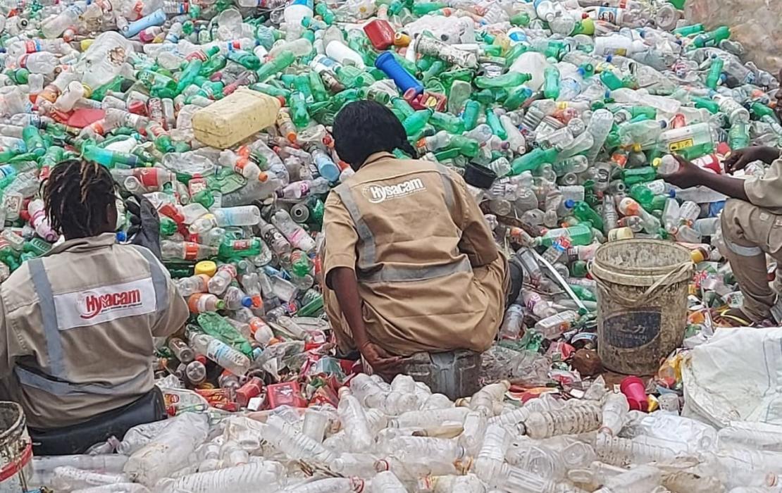 Employees of the Monrovia-based waste management company, Hysaa Liberia Inc, sorting out plastic waste. 