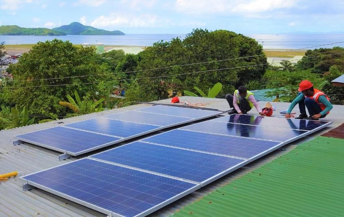 Solar panels being installed on a roof in Seychelles