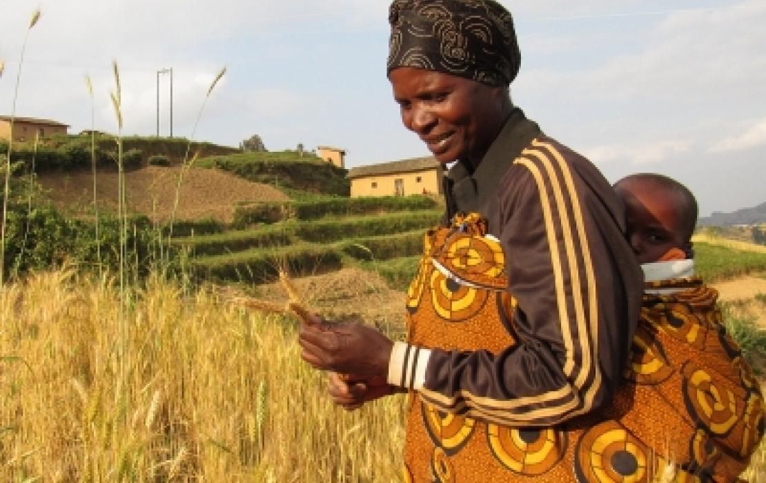 a woman in a field in Rwanda