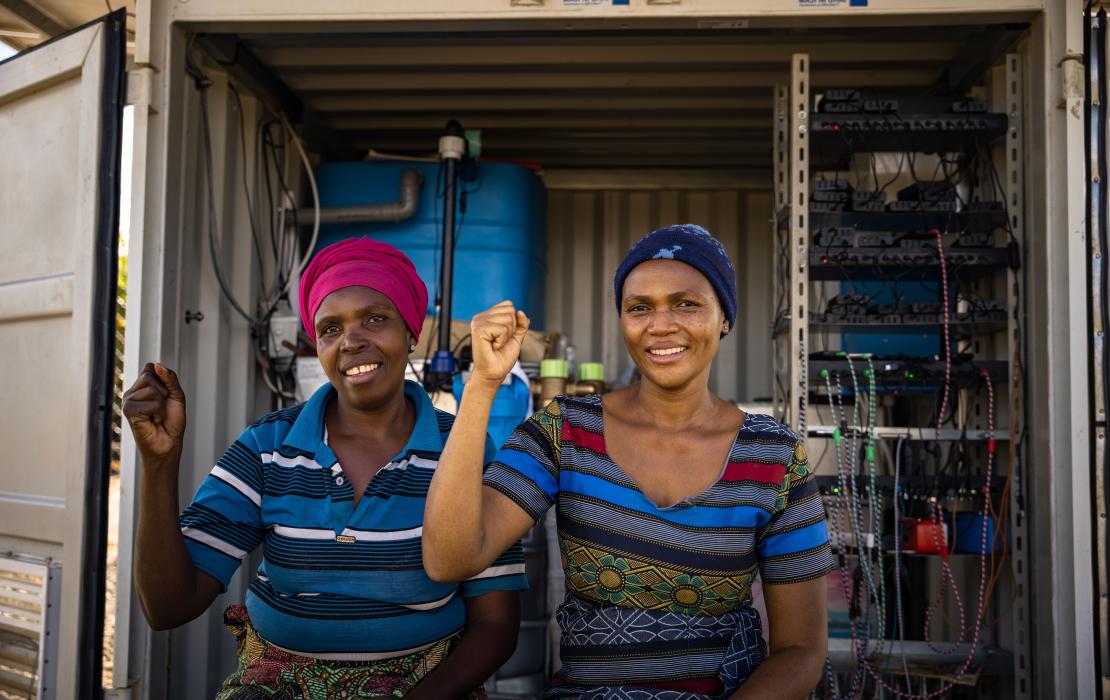 Women in Tanzania with their fist in the air