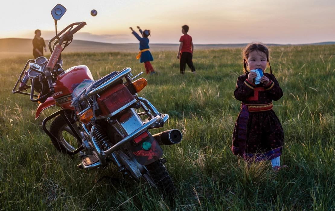 A Mongolian girl in countryside.
