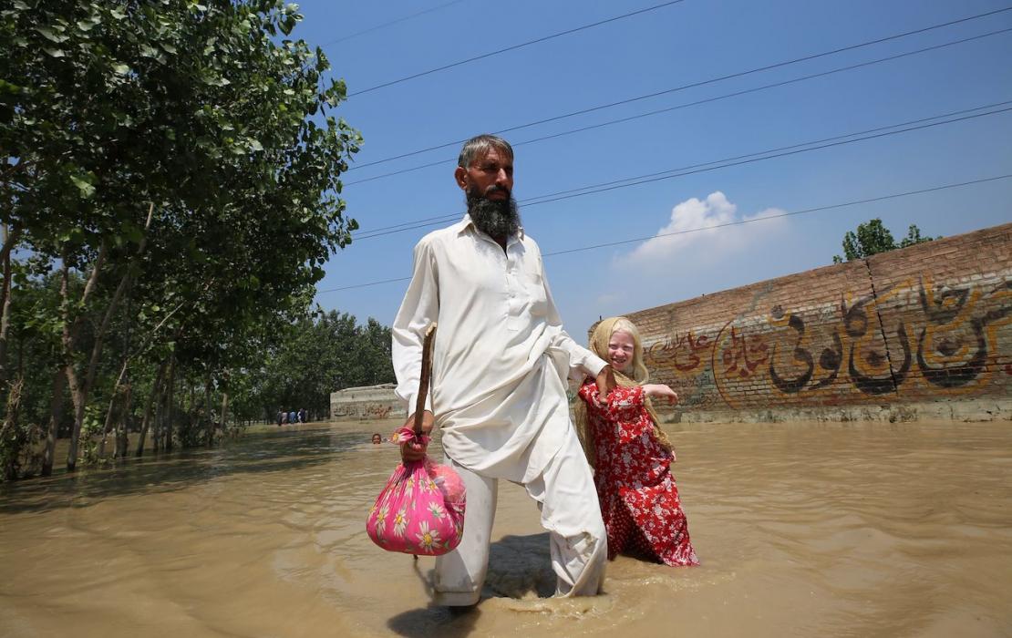Family in a flooded area