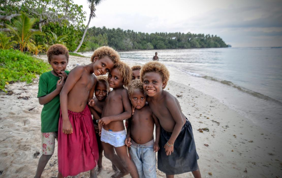 Children in Papua New Guinea playing on the coast