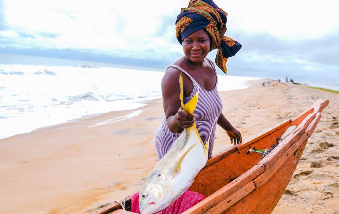A local fish seller from Sulima Township in Pujehun District displaying her catch