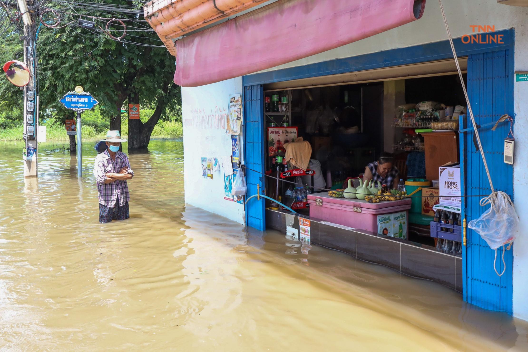 Person standing in a heavy flooded area in Thailand