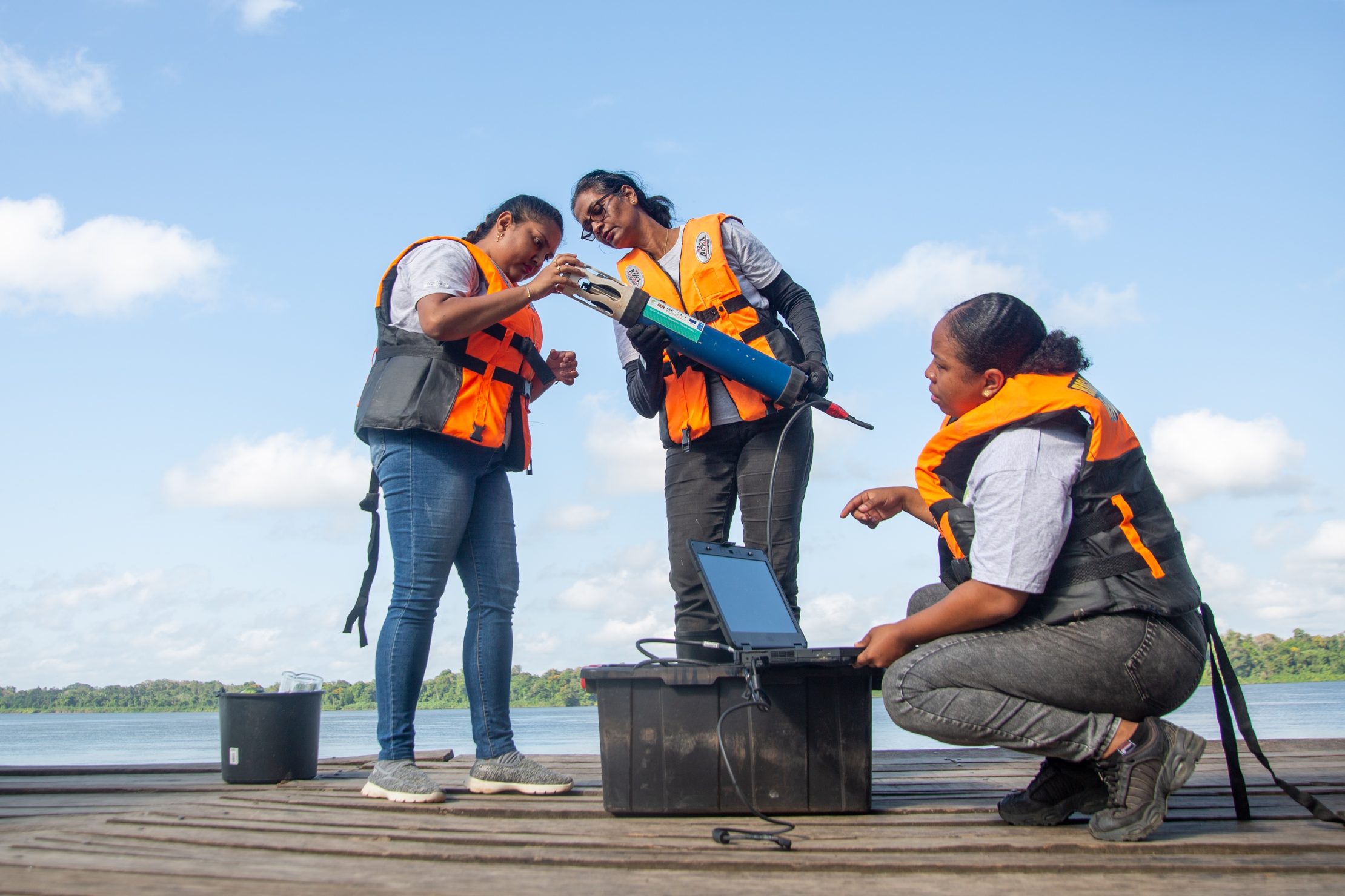 Women conducting water quality measurements in Suriname