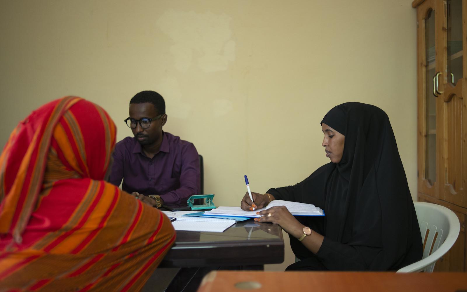 A lawyer speaks with her client during a free legal aid clinic, part of a UNDP funded programme, in Garowe, Puntland.