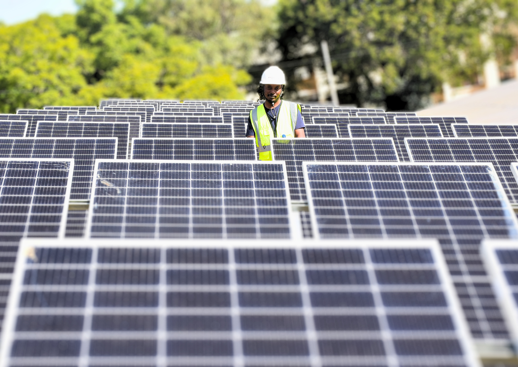 Photo: UNDP Malawi / Florence Leysen Inspecting solar panels, Lilongwe, Malawi