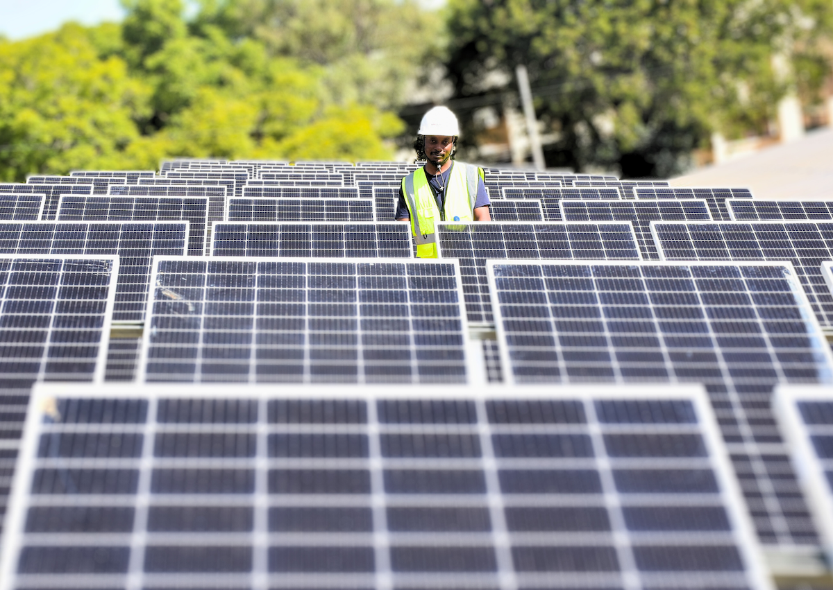 Inspecting solar panels, Lilongwe, Malawi
