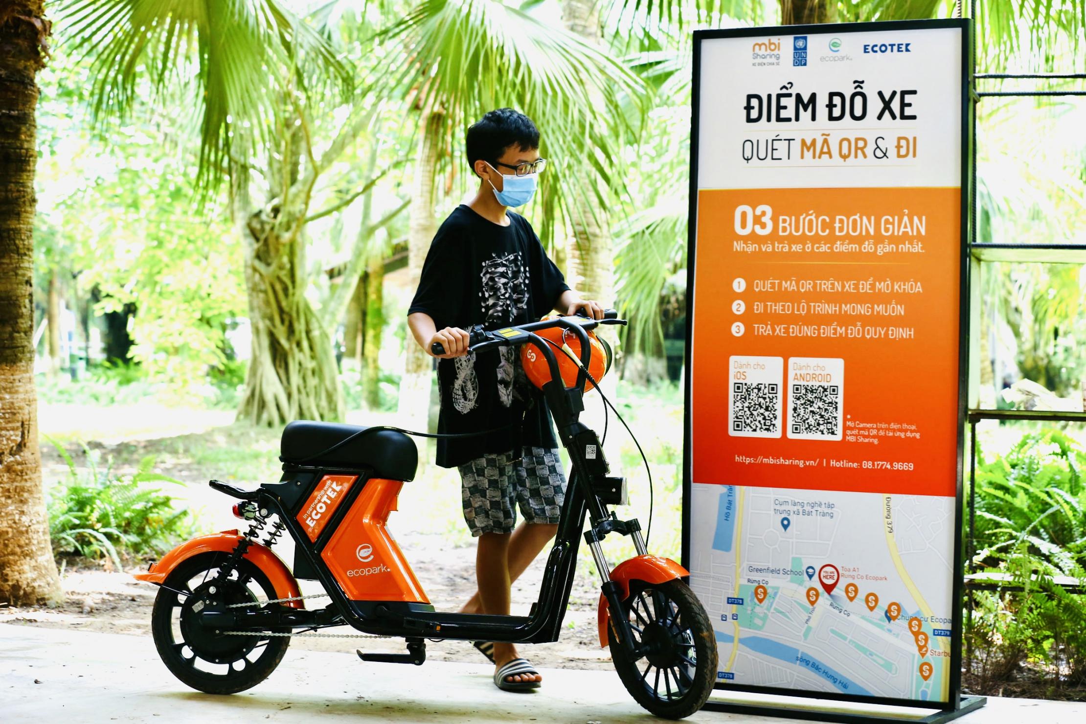 A young man riding an electric bike in Vietnam