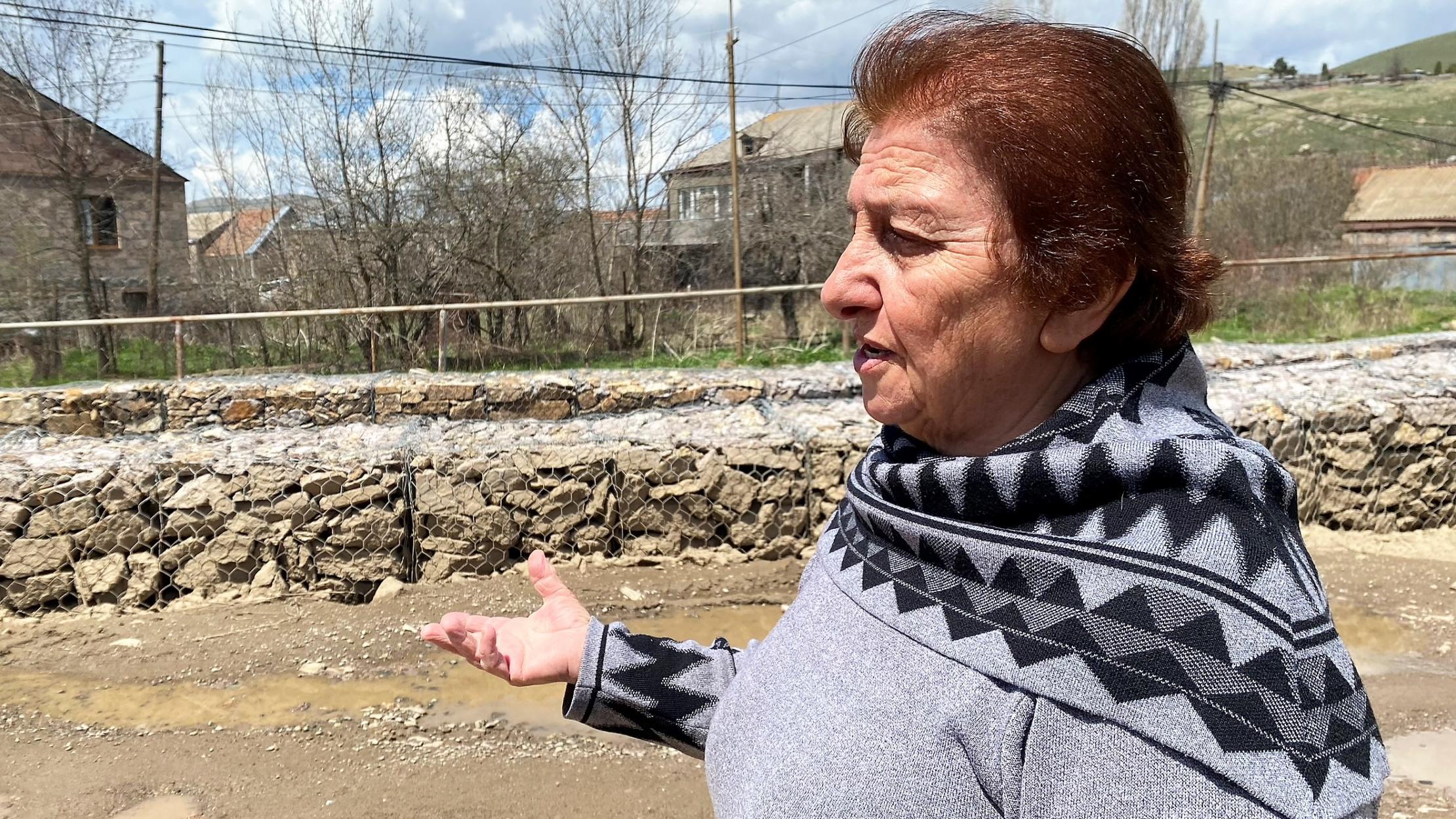 Susanna Avagyan, a retired teacher who lives by the riverbank in Chambarak