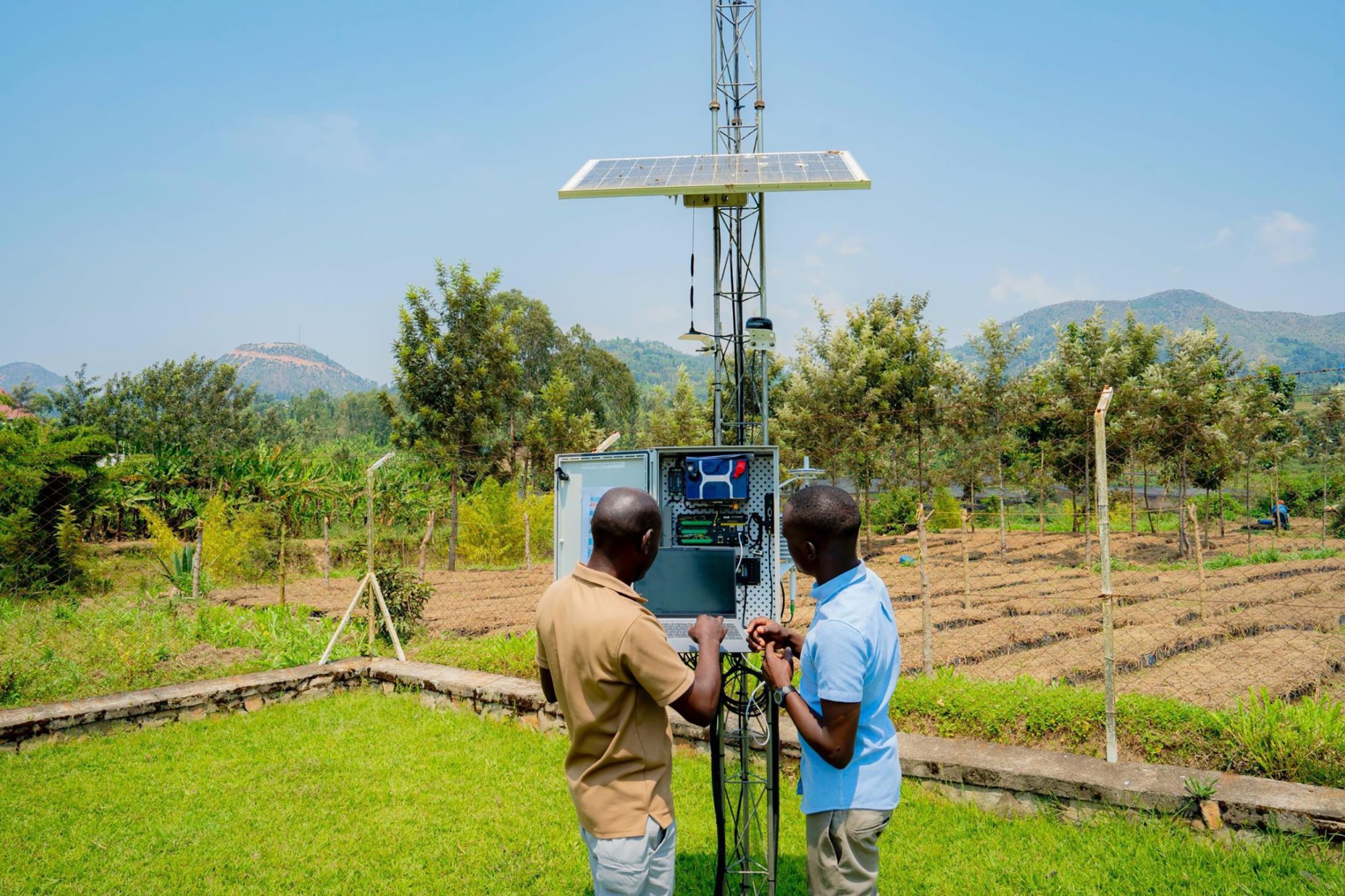 Rwanda has made climate information and early warning a priority in its NDC, upgrading climate monitoring infrastructure with SOFF support. Photo: UNDP Rwanda Technicians inspect an automatic weather station.