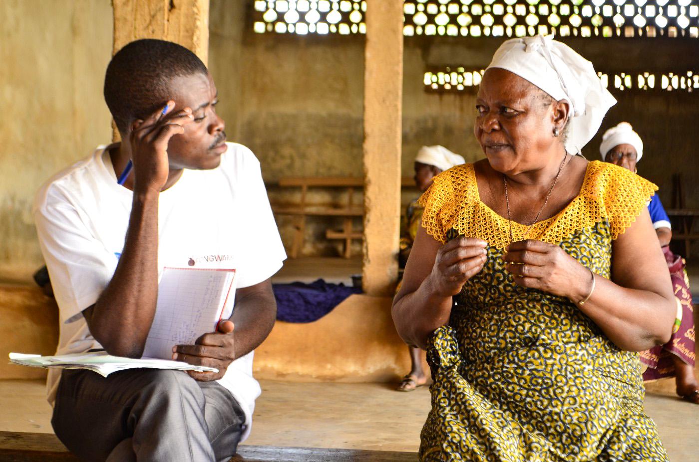 A woman and a man having a discussion in the Republic of Congo