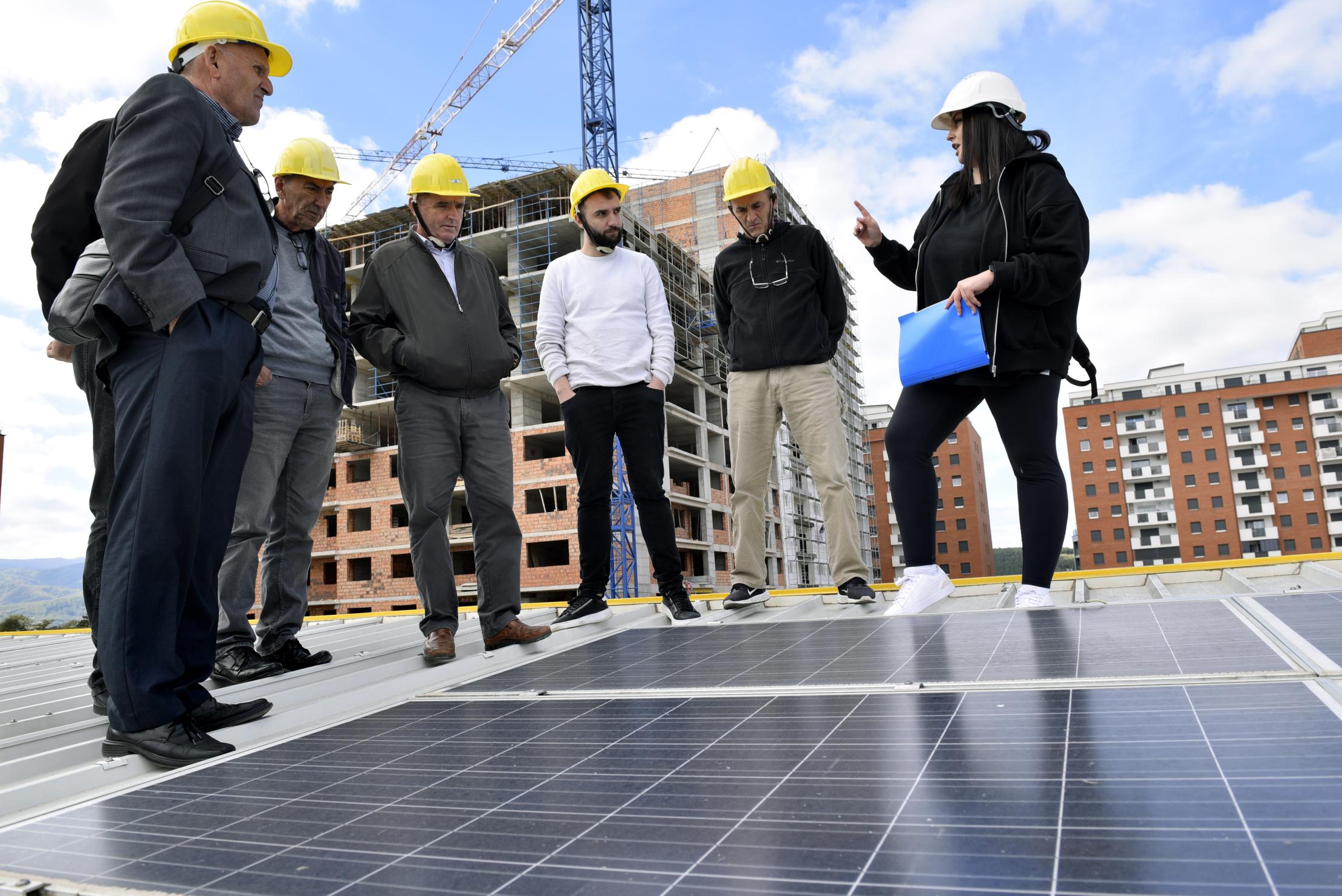 A group of workers being trained on installing solar panels in Kosovo*.