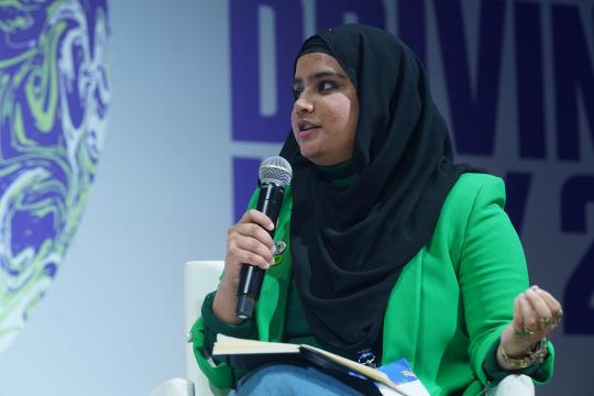 Saher Rashed Baig on stage at COP26