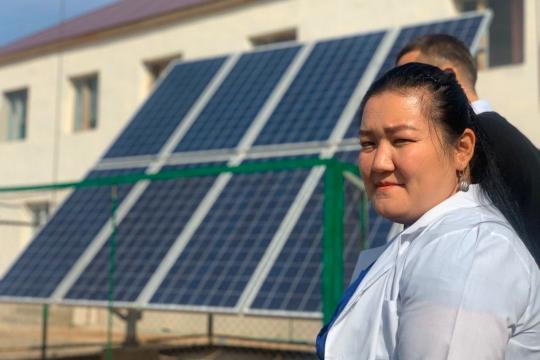 A health worker at a clinic powered by solar panels installed with UNDP support.