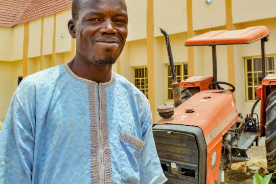 A smiling worker in Nigeria