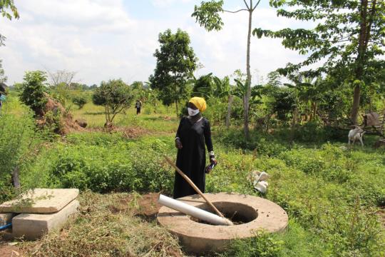A member of the Uganda Muslim Development Rural Development Association using organic material to produce biogas for cooking. Photo: UNDP Uganda A member of the Uganda Muslim Development Rural Development Association using organic material to produce biogas for cooking.