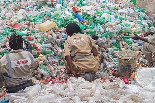 Employees of the Monrovia-based waste management company, Hysaa Liberia Inc, sorting out plastic waste.