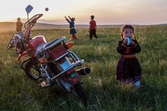 A Mongolian girl in countryside.