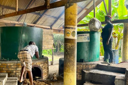 A woman processing palm oil in Eastern Ghana
