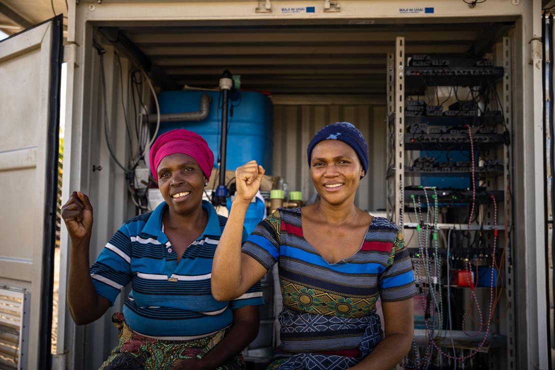 Women in Tanzania with their fist in the air