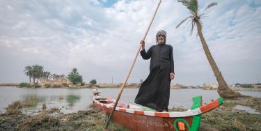 Man in a boat in the Iraqi marshes