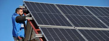 Man installing solar panel in Montenegro