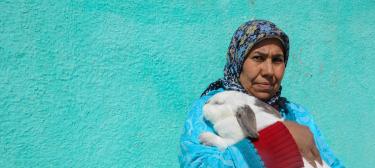 Woman holding rabbit in Morocco