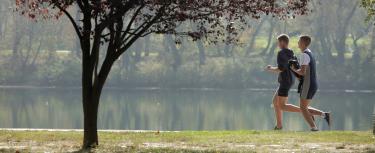 Young men running in park in Serbia