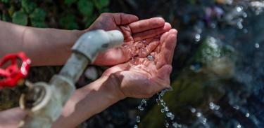 Hands holding water in Turkmenistan