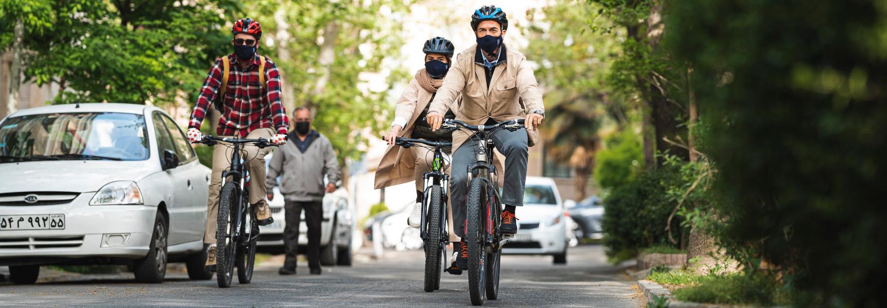 Men riding bikes in Iran