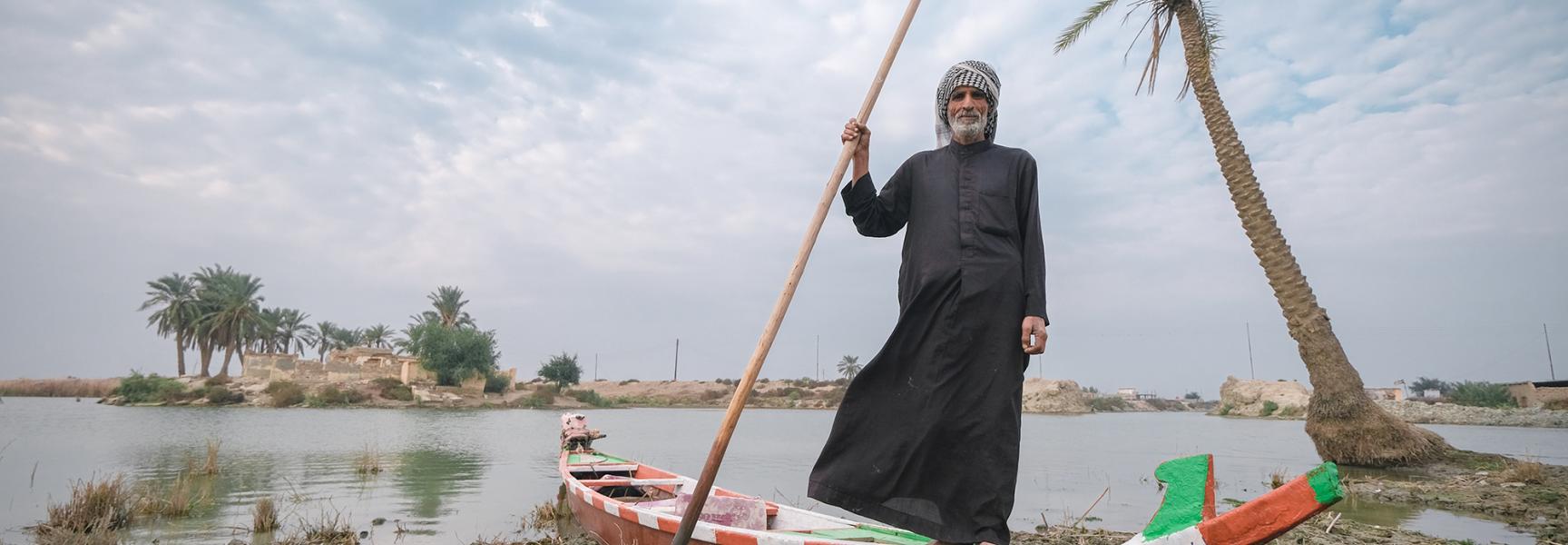 Man in a boat in the Iraqi marshes