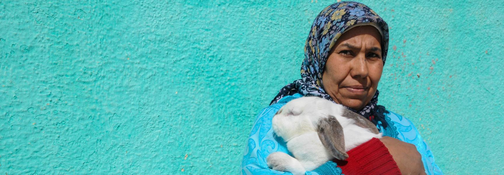 Woman holding rabbit in Morocco