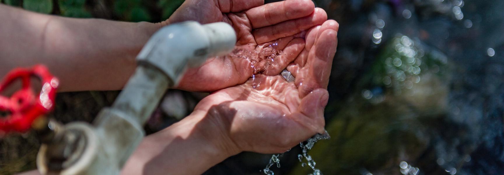 Hands holding water in Turkmenistan